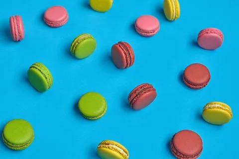 Colored macaron or macaroon, sweet meringue-based confection on blue backg... Fotos Stock