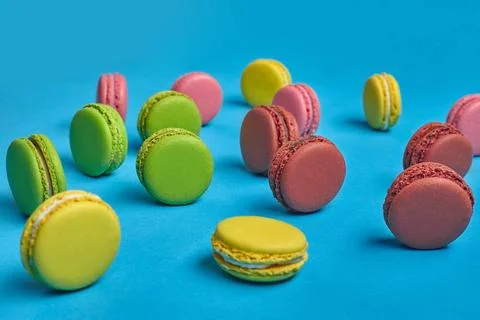 Colored macaron or macaroon, sweet meringue-based confection on blue backg... Fotos Stock