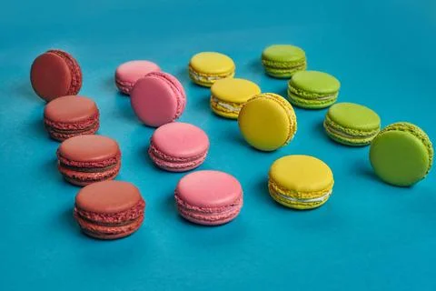 Colored macaron or macaroon, sweet meringue-based confection on blue backg... Fotos Stock