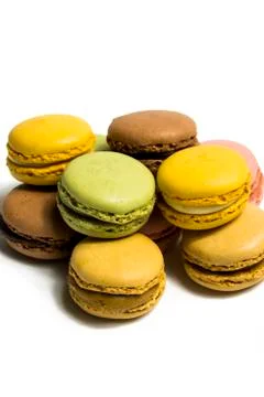 Colored macarons isolated on white background, typical French dish Stock Photos