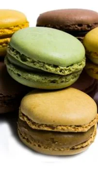 Colored macarons isolated on white background, typical French dish 스톡 사진