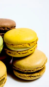 Colored macarons isolated on white background, typical French dish Stock Photos