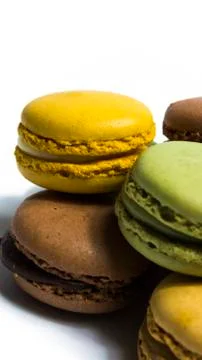 Colored macarons isolated on white background, typical French dish Foto stock