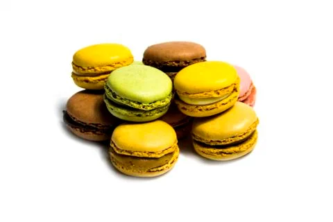 Colored macarons isolated on white background, typical French dish Stock Photos