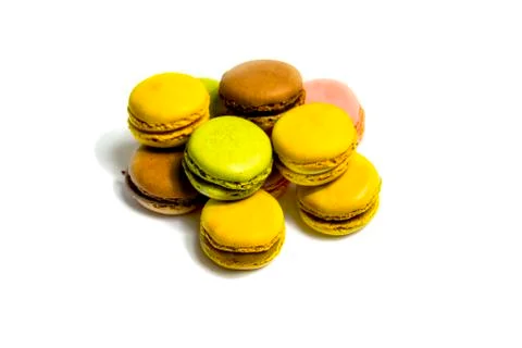 Colored macarons isolated on white background, typical French dish Stock Photos