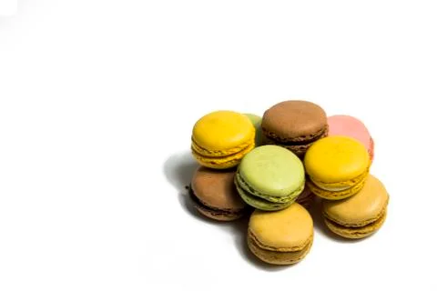 Colored macarons isolated on white background, typical French dish Stock Photos