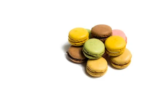 Colored macarons isolated on white background, typical French dish Stock Photos