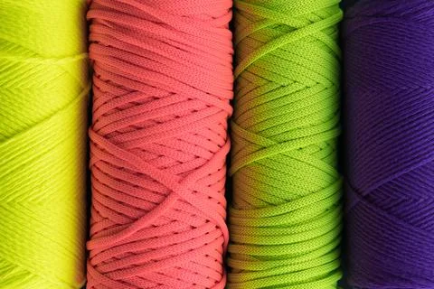 Colored macrame yarn background. Skeins of cotton yarn for macrame knitting Stock Photos