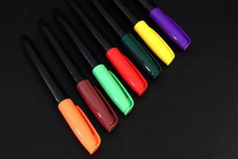 Colored markers on a black background 스톡 사진