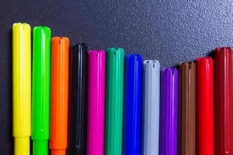 Colored markers in row Stock Photos