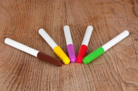 Colored markers on the table Stock Photos