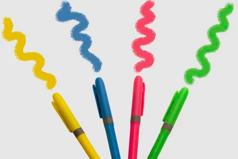 Colored markers on white background with a fun design Stock Photos