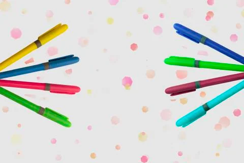 Colored markers on white background with a fun design Photos