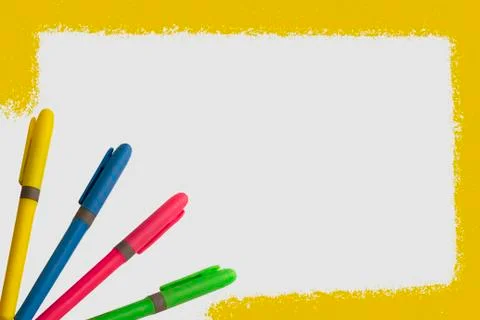 Colored markers on white background with a fun design Stock Photos