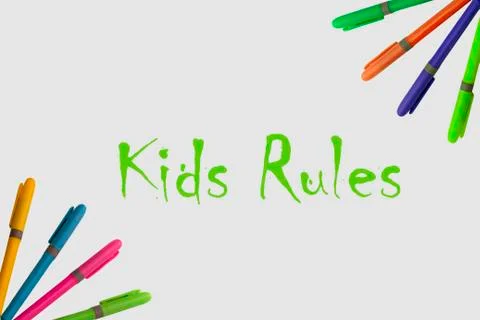 Colored markers on white background with a fun design Stock Photos