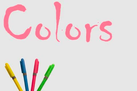 Colored markers on white background with a fun design Stock Photos