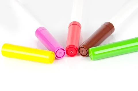 Colored markers on white background Stock Photos