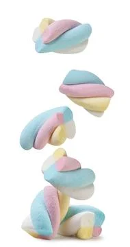 Colored marshmallow falls close-up on a white . Isolated Stock Photos