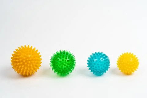 Colored massage needle balls of different sizes on a white background, the Stock Photos