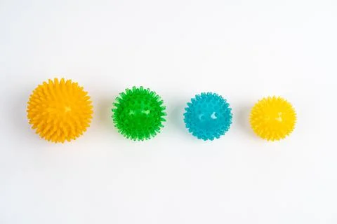 Colored massage needle balls of different sizes on a white background, the Stock Photos