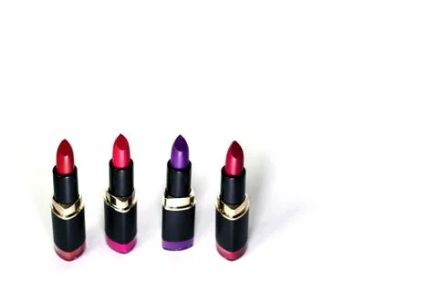 Colored matte lipsticks on a white background Stock Photos