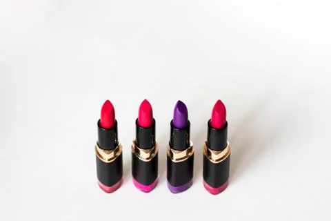 Colored matte lipsticks on a white background. Stock Photos