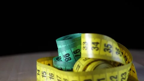 Colored measuring tapes rotates on the turntable Stock Footage 277544356