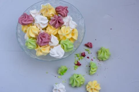 Colored meringue sweets, marshmallows, cake Stock Photos