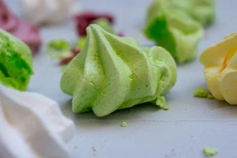 Colored meringue sweets, marshmallows, cake Stock Photos