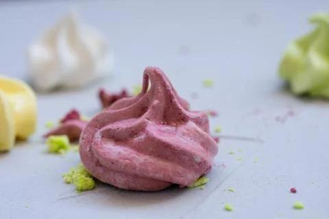 Colored meringue sweets, marshmallows, cake Stock Photos