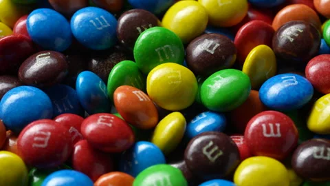 Colored mini M&amp;M's candies. M&amp;M's is flagship product of Mars, Incorporated Stock Footage 300393767
