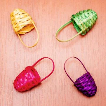 Colored multicolored small baskets on the table Stock Photos