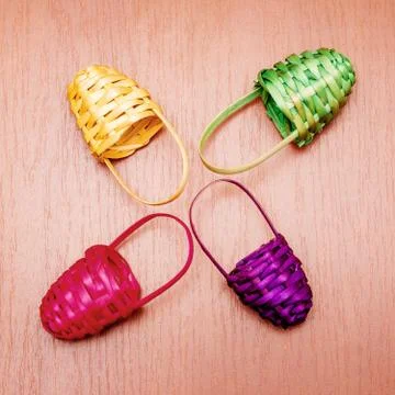 Colored multicolored small baskets on the table 스톡 사진