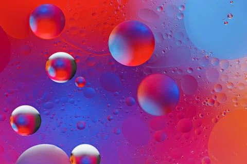 Colored neon bubbles on gradient background Foto stock