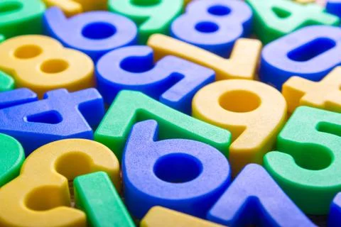Colored numbers on table Stock Photos