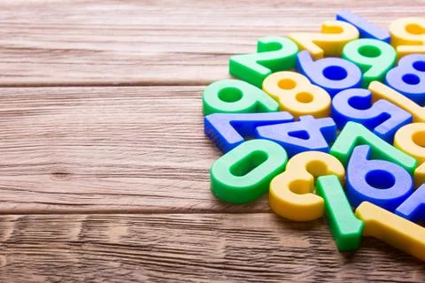 Colored numbers on table Stock Photos