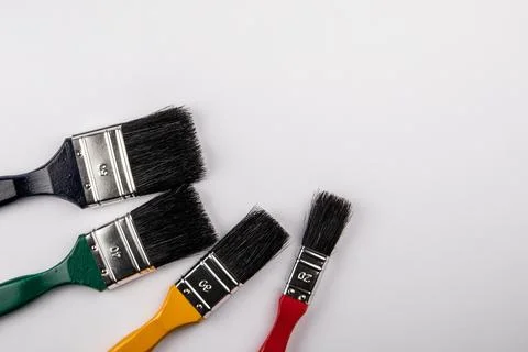 Colored Paint Brushes of different sizes. Copy space for text, illustration and Stock Photos