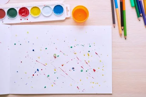 Colored paint on a white sheet Stockfoto's