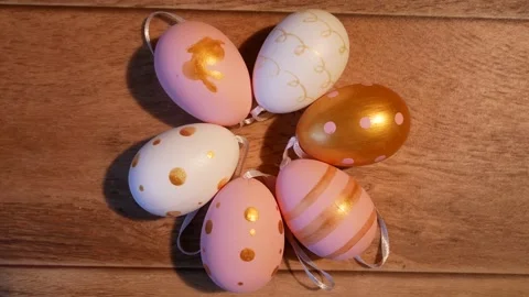 Colored painted Easter eggs on a background of wooden boards Stock Footage 177285549