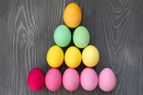 Colored painted eggs on a gray background. Easter celebrating Stock Photos