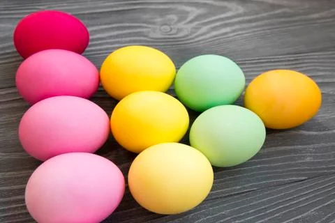 Colored painted eggs on a gray background. Easter celebrating Stock Photos