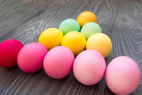 Colored painted eggs on a gray background. Easter celebrating Stock Photos