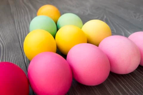 Colored painted eggs on a gray background. Easter celebrating Stock Photos