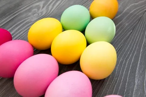 Colored painted eggs on a gray background. Easter celebrating Stock Photos