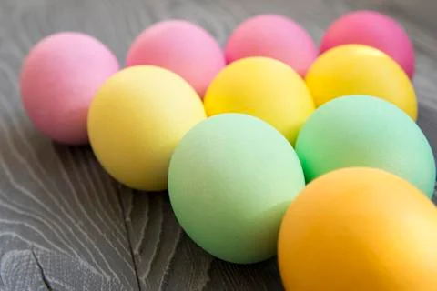 Colored painted eggs on a gray background. Easter celebrating Stock Photos