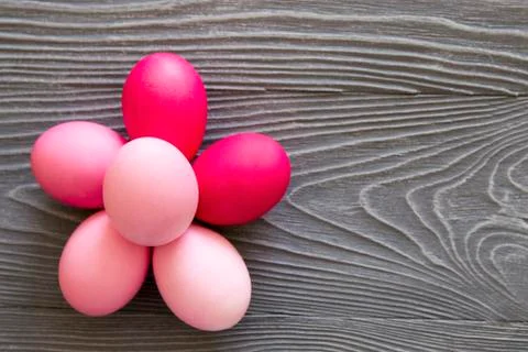 Colored painted eggs on a gray background. Easter celebrating Stock Photos