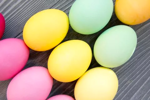 Colored painted eggs on a gray background. Easter celebrating Stock Photos