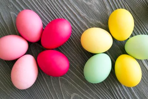Colored painted eggs on a gray background. Easter celebrating Stock Photos