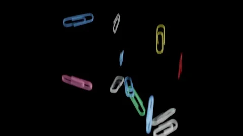 Colored paper clips in the air Video stock 86283458