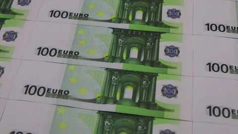 Colored paper clips fall from above on a pile of 100 euro banknotes, FullHD Vídeos de archivo 145346122